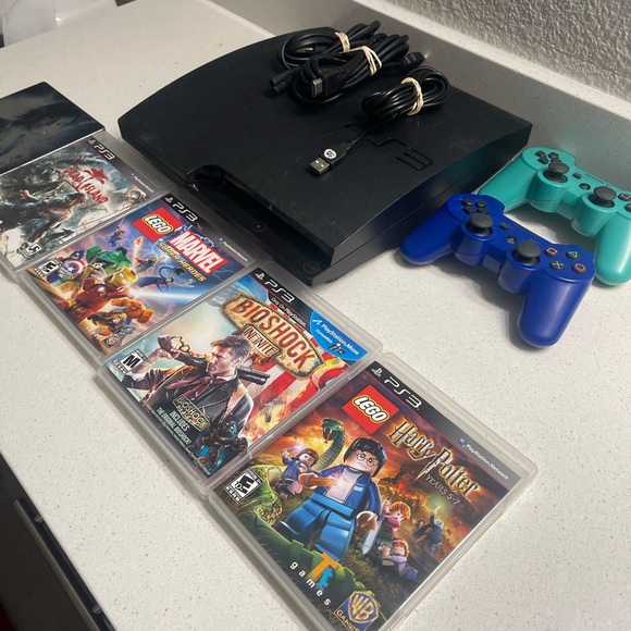 Sony PlayStation 3 Console with Black and Blue Controllers